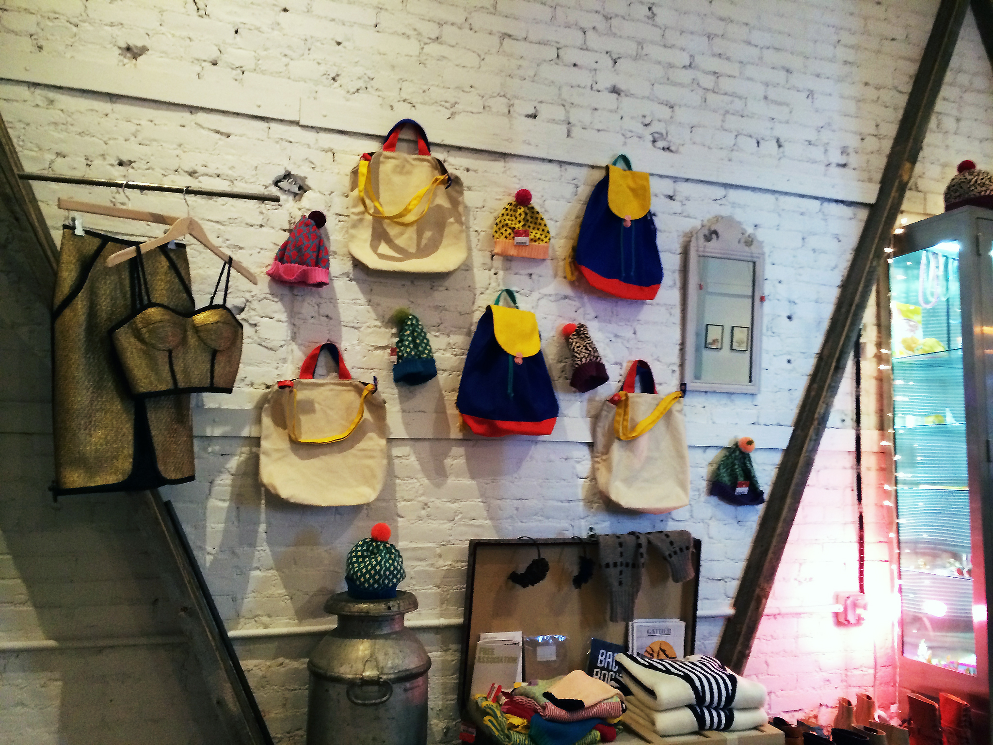 Backpack accessory wall at American Two Shot in New York. Photo by alphacityguides.