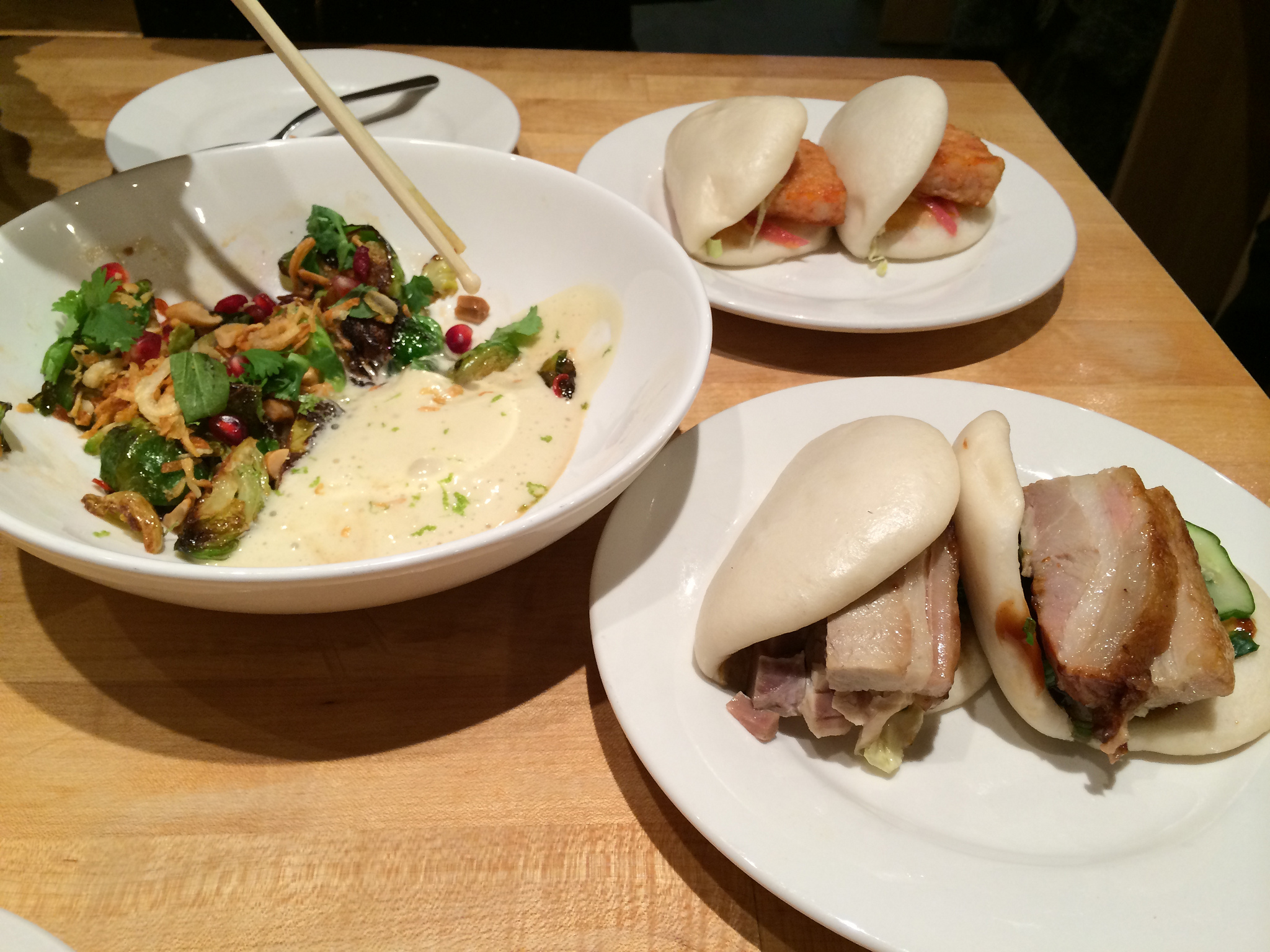 Buns and brussel sprouts at Momofuku Noodle Bar in New York. Photo by alphacityguides.