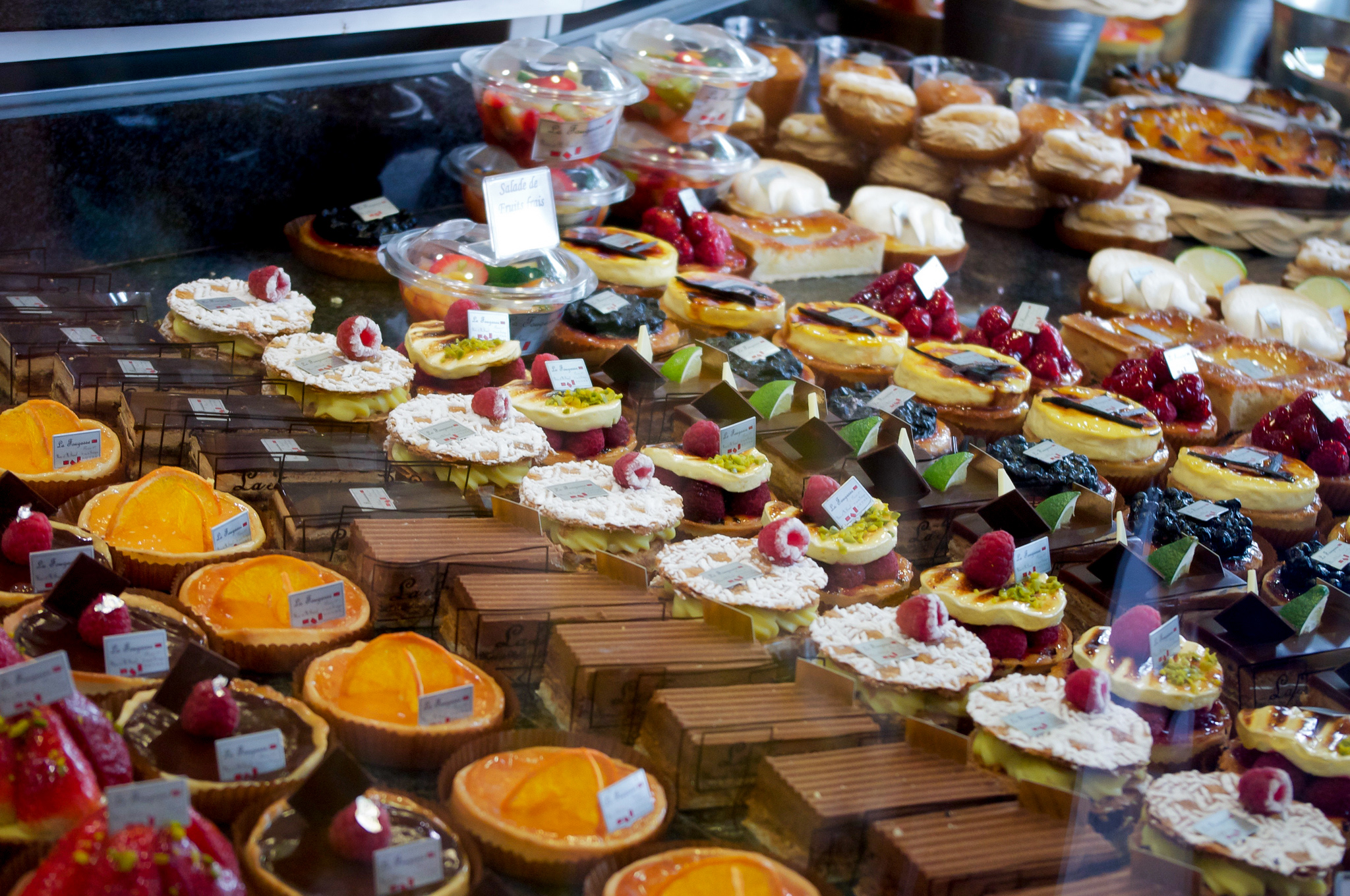 Tart display at La Fougasse in Paris. Photo by alphacityguides.