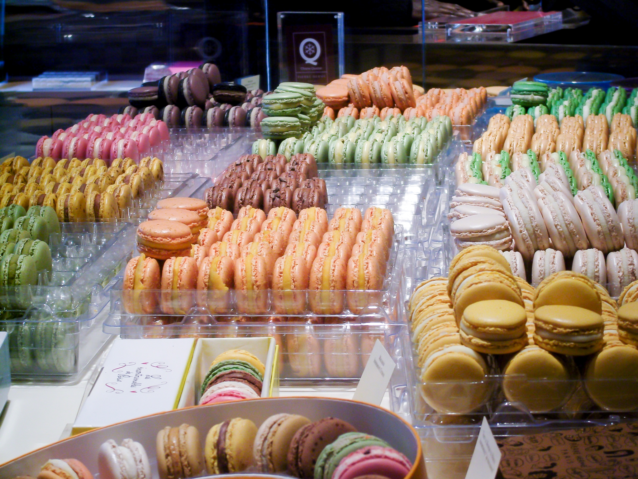 Macaron display at Pierre Hermé in Paris. Photo by alphacityguides.