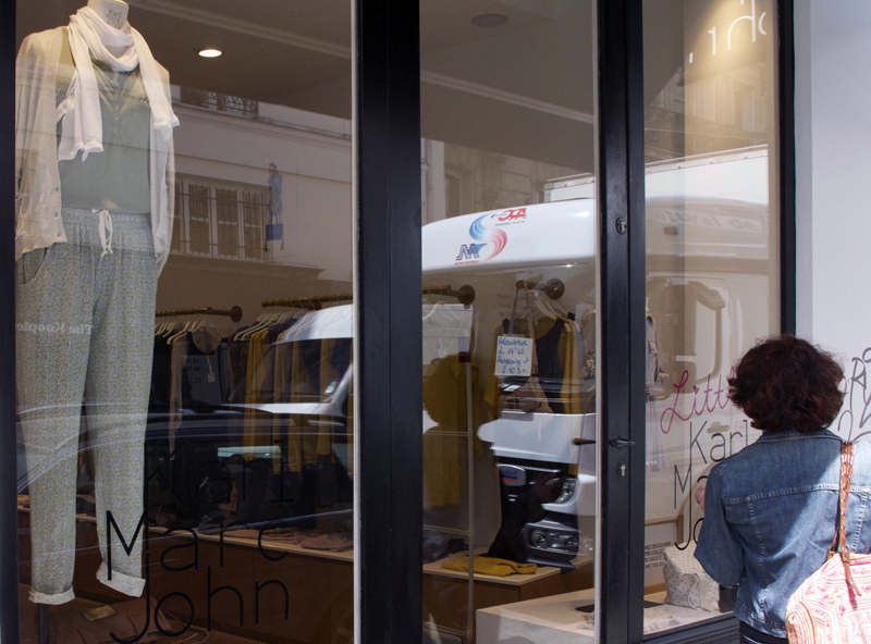Window and store front at Karl Marc John in Paris. Photo by alphacityguides.