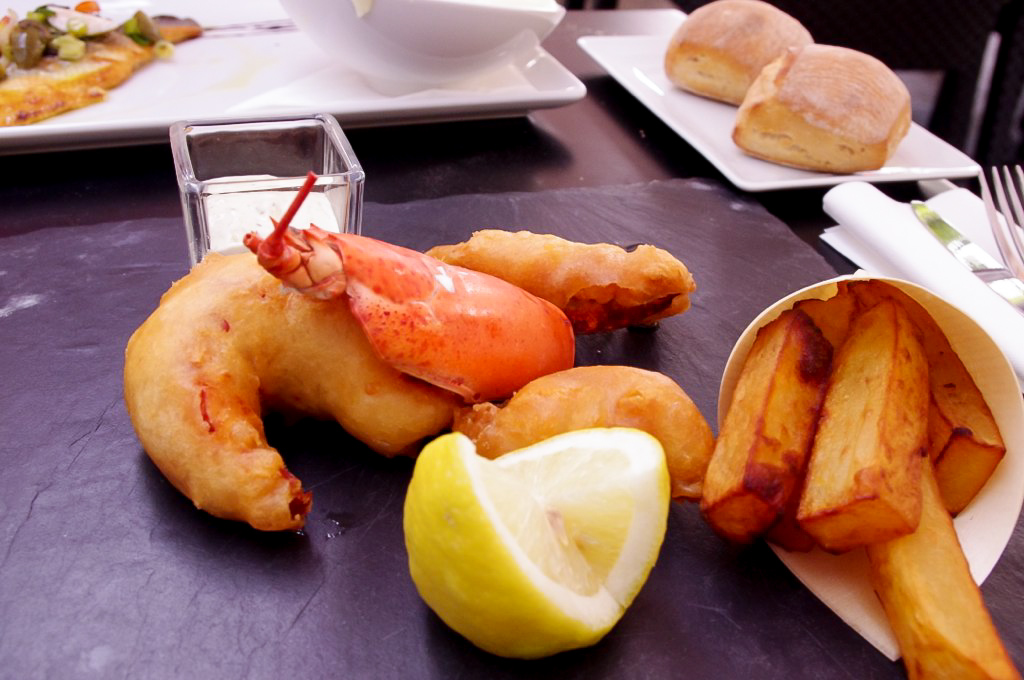 Lobster fish and chips at Publicis Drugstore Brasserie in Paris. Photo by alphacityguides.