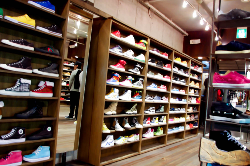 Sneaker wall at Gettry in Tokyo. Photo by alphacityguides.