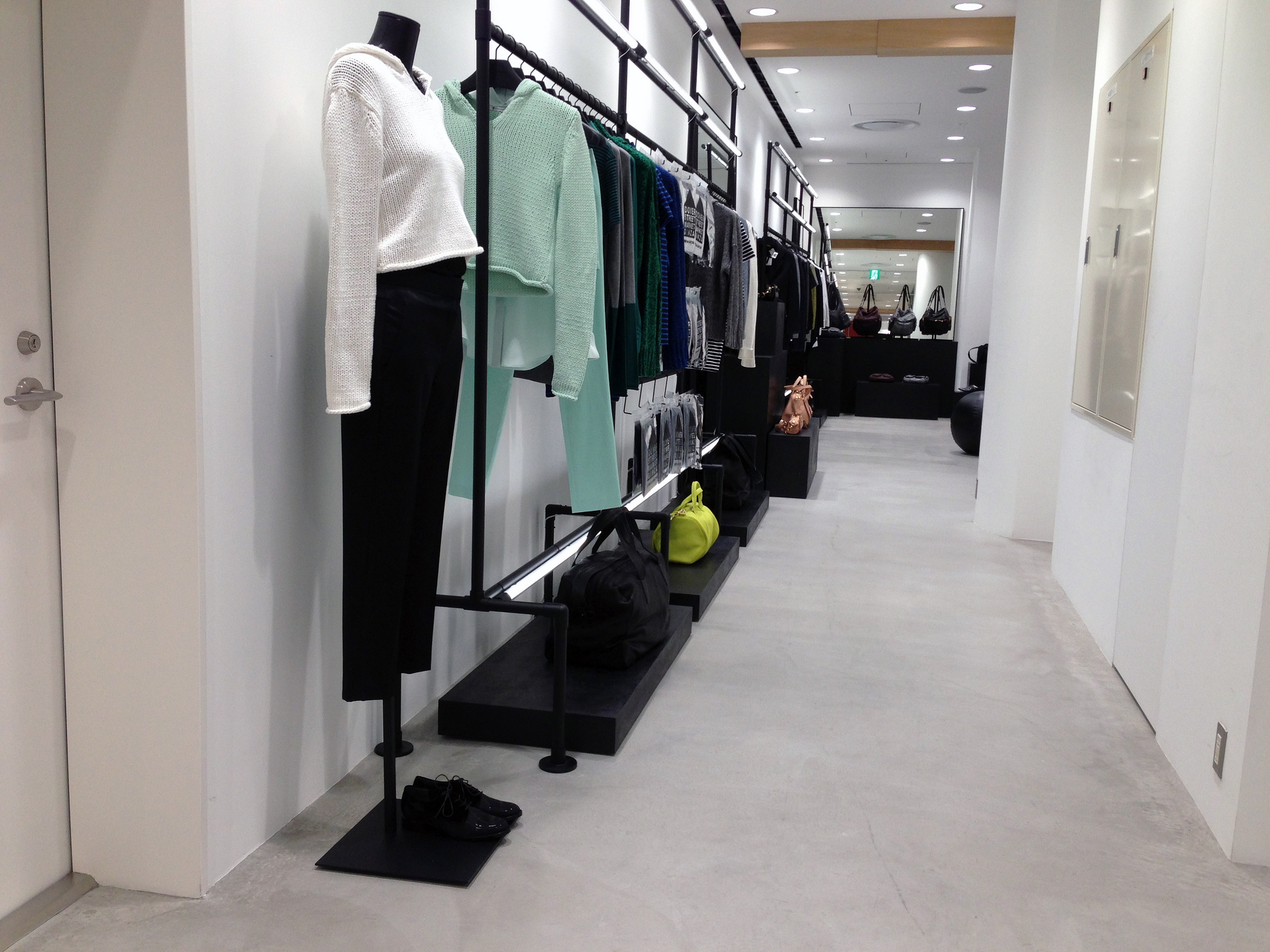 Fashion display and merchandising inside Dover Street Market in Tokyo. Photo by alphacityguides.