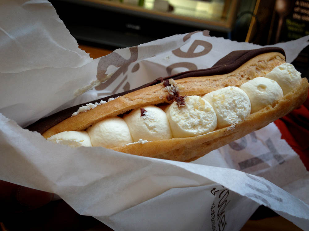 Chocolate Eclair with chantilly cream at Euporium Bakery in Covent Garden, London. Photo by alphacityguides.