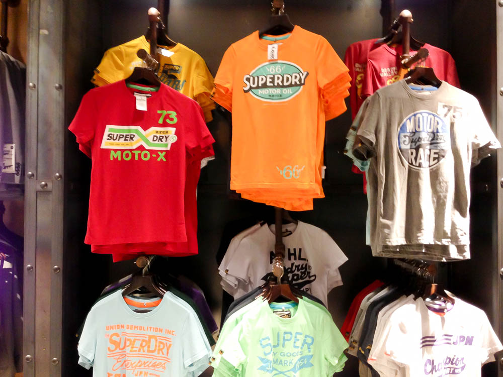 T-shirt wall at Superdry in London. Photo by alphacityguides.