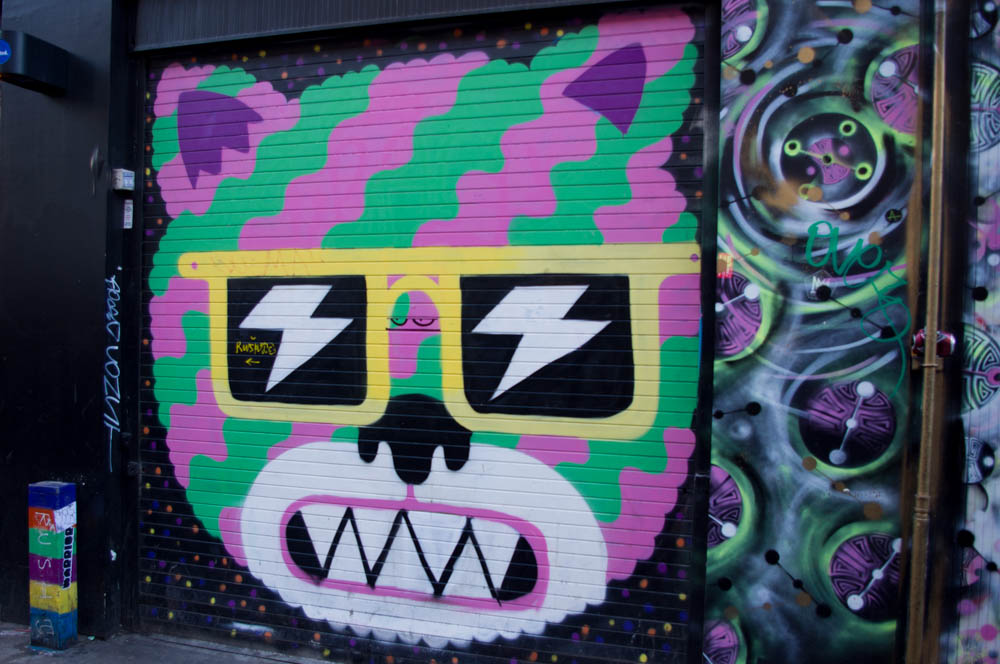 Graffiti at Brick Lane in London. Photo by alphacityguides.