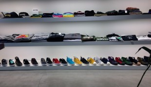 Sneaker and t-shirt wall at atmos in Tokyo. Photo by alphacityguides.