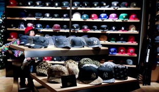 Hat wall inside New Era in Tokyo. Photo by alphacityguides.