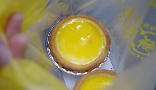 Egg tart at Tai Cheong Bakery in Hong Kong. Photo by alphacityguides.