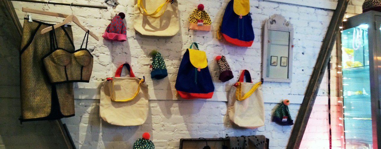 Backpack accessory wall at American Two Shot in New York. Photo by alphacityguides.