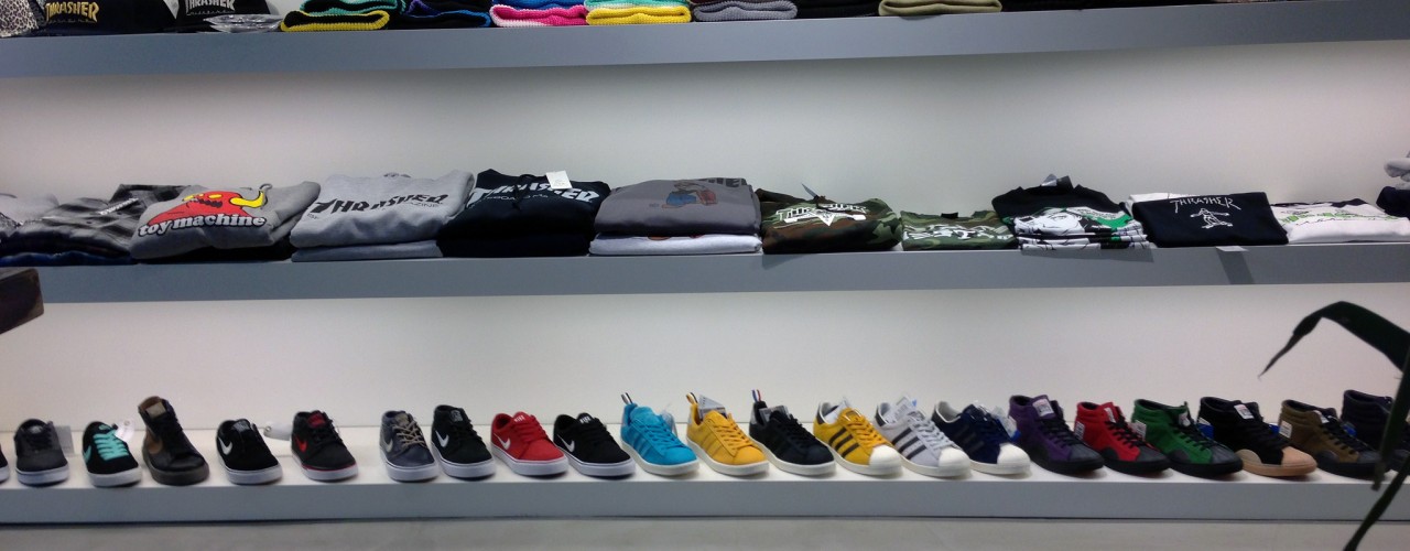 Sneaker and t-shirt wall at atmos in Tokyo. Photo by alphacityguides.