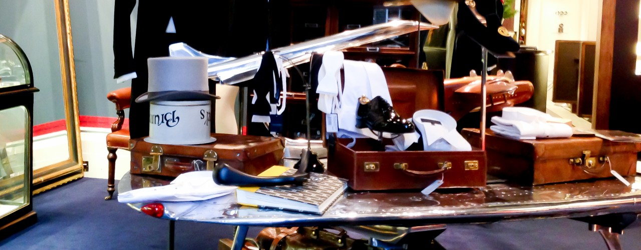 Suiting and accessories inside of Gieves & Hawkes on Savile Row in London. Photo by alphacityguides.