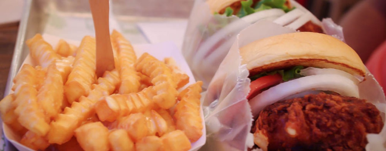 Shroom burgers (deep fried cheese and portabello pattie) & fries at Shake Shack, New York. Photo by alphacityguides.