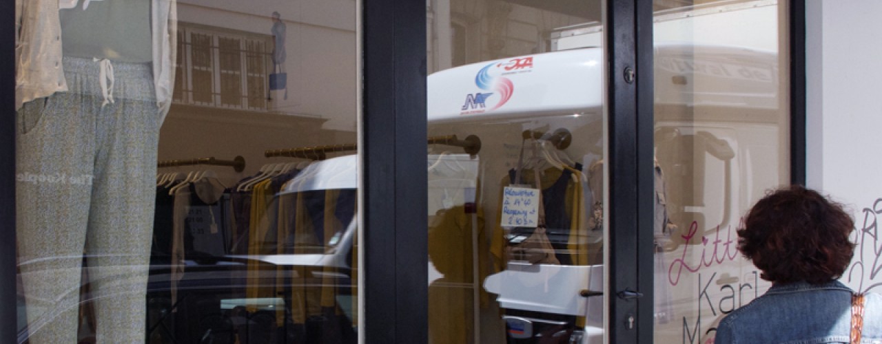 Window and store front at Karl Marc John in Paris. Photo by alphacityguides.