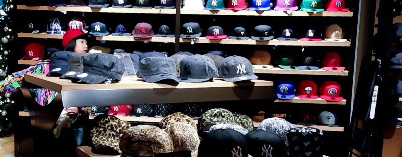 Hat wall inside New Era in Tokyo. Photo by alphacityguides.