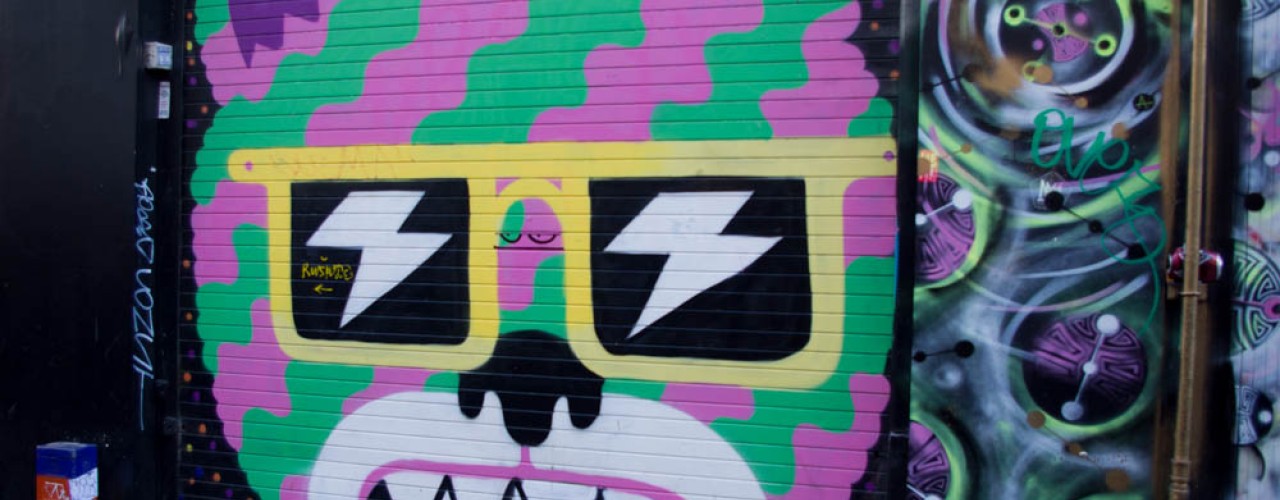 Graffiti at Brick Lane in London. Photo by alphacityguides.
