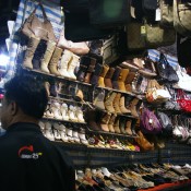 Cheap shoes at the Temple Street Market in Hong Kong. Photo by alphacityguides.
