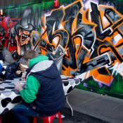 People eating street food at Brick Lane in London. Photo by alphacityguides.