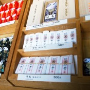 Prayer trinkets and good luck charms at Meiji Shrine in Tokyo. Photo by alphacityguides.