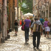 Man and his accordion in Rome. Photo by alphacityguides.