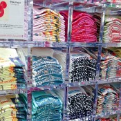 T-shirt wall inside Uniqlo in Tokyo. Photo by alphacityguides.