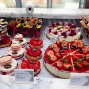 Cake and pastry diplay at Harrods in London. Photo by alphacityguides.