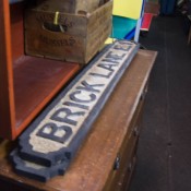 Antique Brick Lane sign in London. Photo by alphacityguides.