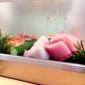 Sushi display case at Daiwa Sushi in Tokyo. Photo by alphacityguides.
