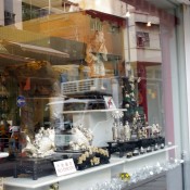 Window display of carved antique statues on Hollywood Road in Hong Kong. Photo by alphacityguides.