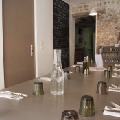 Communal dining table at Tartes Kluger in Paris. Photo by alphacityguides.