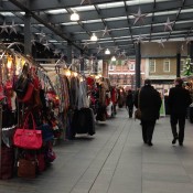 Collection of stalls at Old Spitalfields Market in London. Photo by alphacityguides.