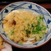 Udon with toppings at Muginbo in Tokyo. Photo by alphacityguides.