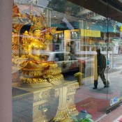 Window display of gold antiques on Hollywood Road in Hong Kong. Photo by alphacityguides.