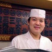 Young sushi chef at Sushi Dai in Tokyo. Photo by alphacityguides.