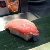 Sushi at Standing Sushi in Tokyo. Photo by alphacityguides.