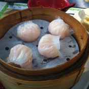 Steamed shrimp dumplings at Tim Ho Wan in Hong Kong. Photo by alphacityguides.