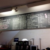 Coffee station and menu board at Dominique Ansel Bakery. Photo by alphcityguides.