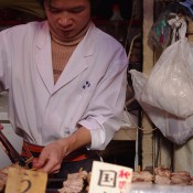 Food stall at Tsukiji Market in Tokyo. Photo by alphacityguides.