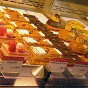 Pastry counter inside Publicis Drugstore in Paris. Photo by alphacityguides.
