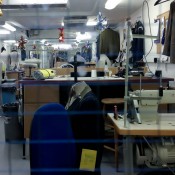 Talior at work at Gieves & Hawkes on Savile Row in London. Photo by alphacityguides.