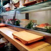 Counter seats at Daiwa Sushi in Tokyo. Photo by alphacityguides.