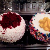 Red velvet and birthday cake cupcakes at Crumbs Bake Shop. Photo by alphaciityguides.