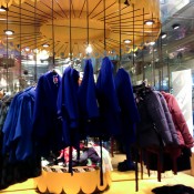 Coats on a carousel at Monki in London. Photo by alphacityguides.