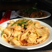 Hot & spicy oil seared handpulled noodle at Xi’an Famous Foods in New York. Photo by alphacityguides.