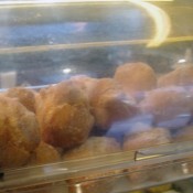 Sugared doughnut display at Tai Cheong Bakery in Hong Kong. Photo by alphacityguides.