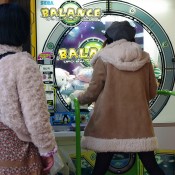 Kids playing video games in Akihabara, Tokyo. Photo by alphacityguides. 