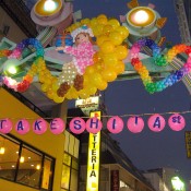 Takeshita Street at night in Tokyo. Photo by alphacityguides.